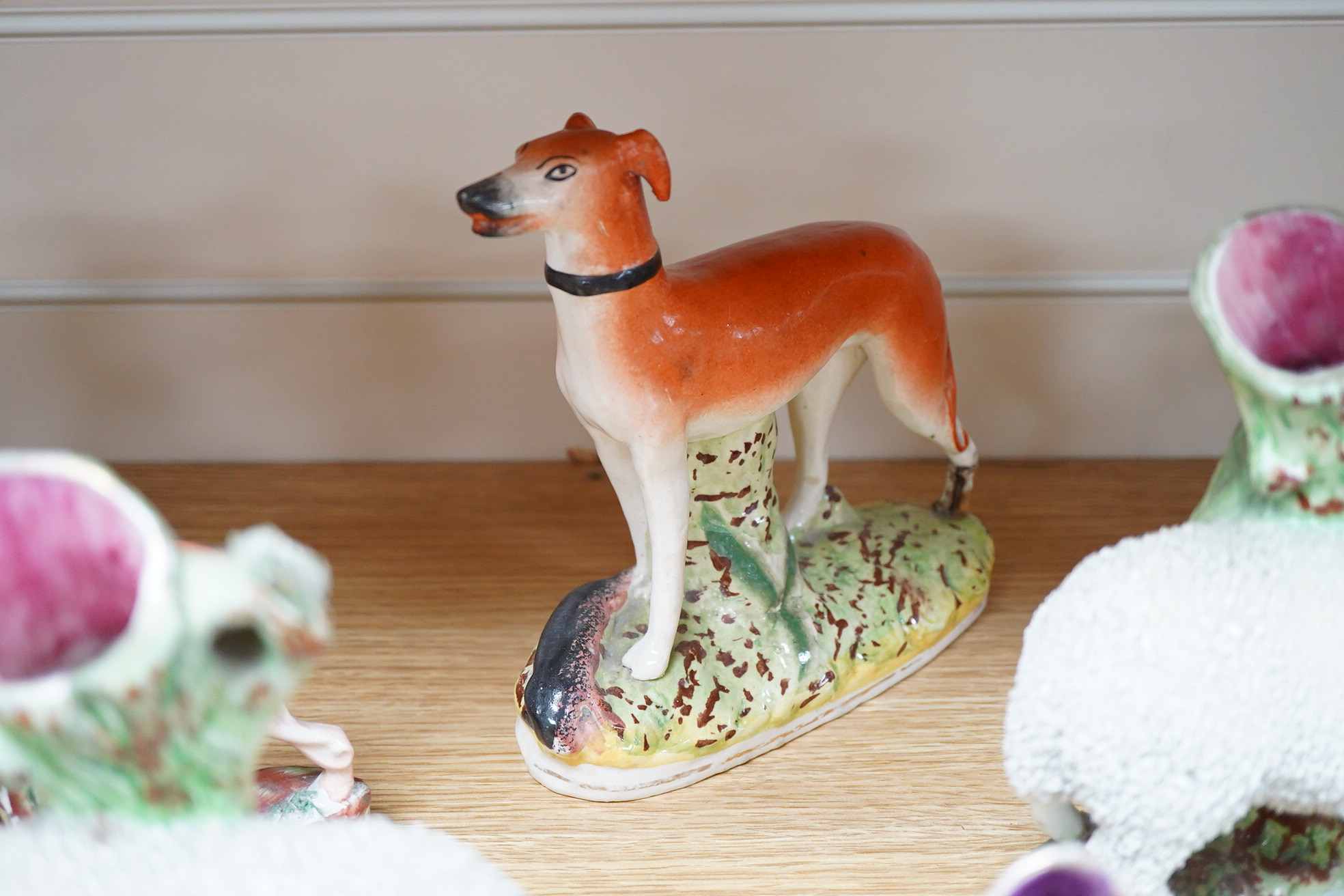 Two pairs of Victorian Staffordshire zebra models and others to include three sheep spill vases, largest 19cm high